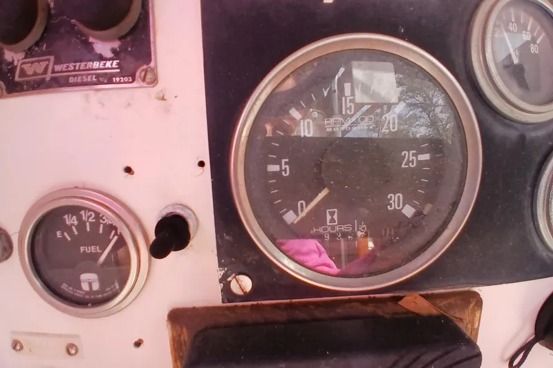 Slide: The Image of Instrument panel of a 1977 Tartan 37 sailboat with fuel and engine gauges. - 32