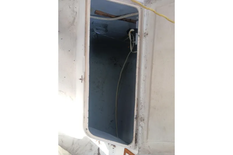 Slide: The Image of Open hatch of a 1977 Tartan 37 sailboat, showing interior compartment. - 33