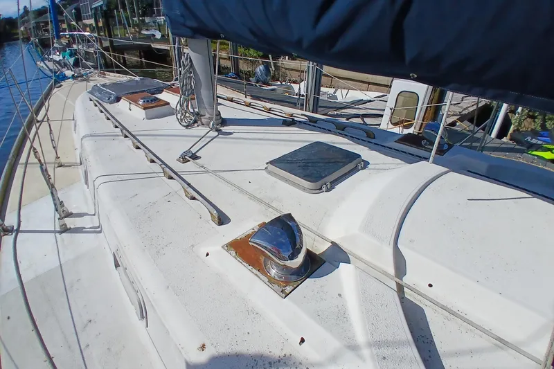 Slide: The Image of Deck view of a 1977 Tartan 37 sailboat, featuring rigging and hatches. - 37