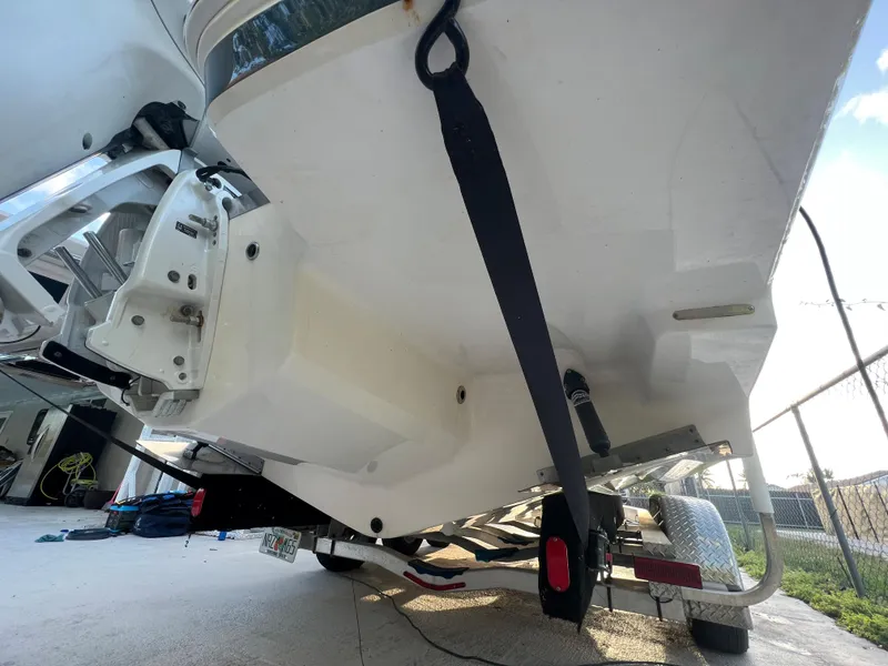 Slide: The Image of 2020 Regal 26 XO boat on trailer, rear view showing hull and outboard motor. - 11