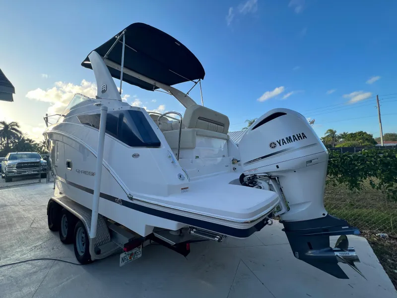 Slide: The Image of 2020 Regal 26 XO boat with Yamaha outboard engine on trailer. - 3