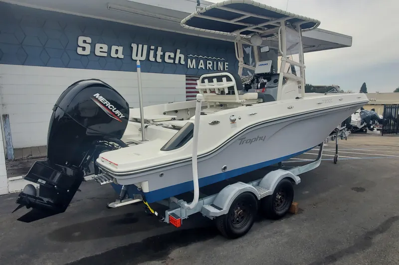 Slide: The Image of 2023 Bayliner Trophy T20CC boat on trailer at Sea Witch Marine dealership. - 2
