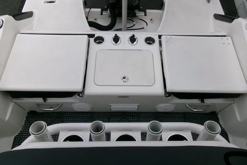 Slide: The Image of 2023 Bayliner Trophy T20CC boat interior with storage compartments and rod holders. - 20