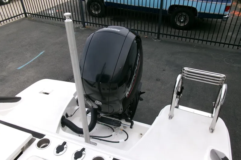 Slide: The Image of 2023 Bayliner Trophy T20CC boat with Mercury outboard motor and ladder. - 24