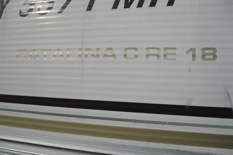 Slide: The Image of 2008 Avalon Catalina 18' boat with model name on the side. - 12