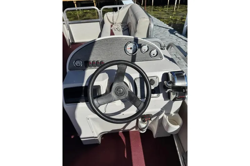 Slide: The Image of Steering console of a 2008 Avalon Catalina 18' boat with gauges and controls. - 6