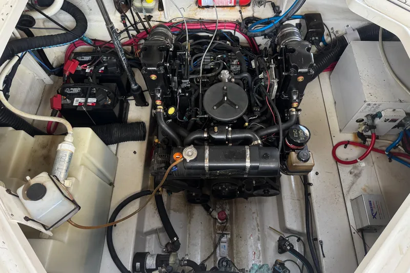 Slide: The Image of Engine compartment of a 2006 Sea Ray Sundancer 260 boat, showing detailed components and wiring. - 14
