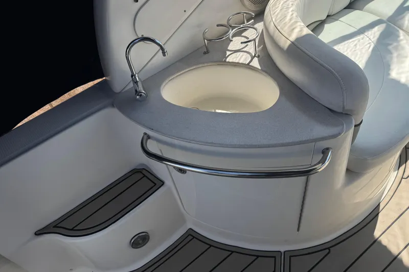 Slide: The Image of Interior of 2006 Sea Ray Sundancer 260 with sink and seating area. - 15