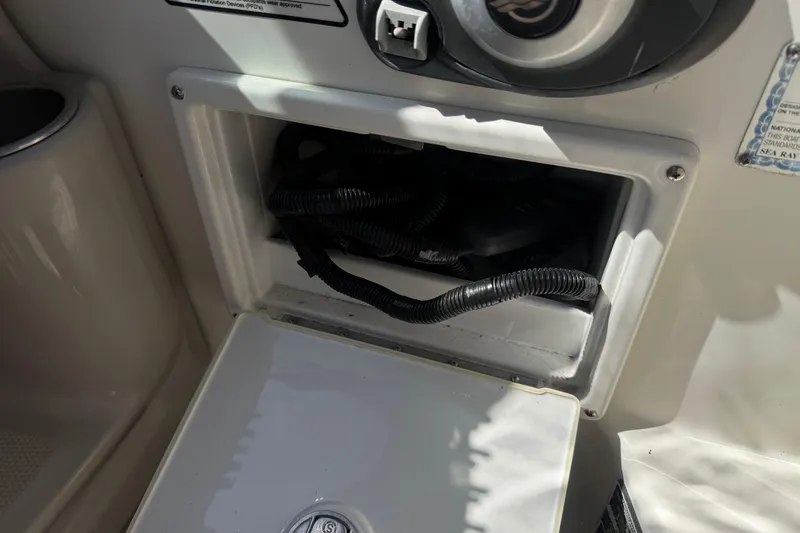 Slide: The Image of Storage compartment on a 2006 Sea Ray Sundancer 260 boat, showing wiring inside. - 21