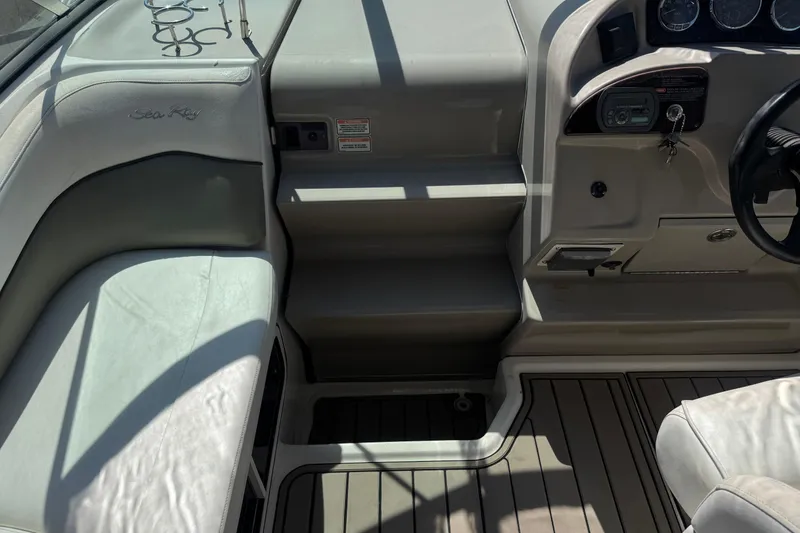 Slide: The Image of 2006 Sea Ray Sundancer 260 cockpit with steering wheel, seating, and control panel. - 22