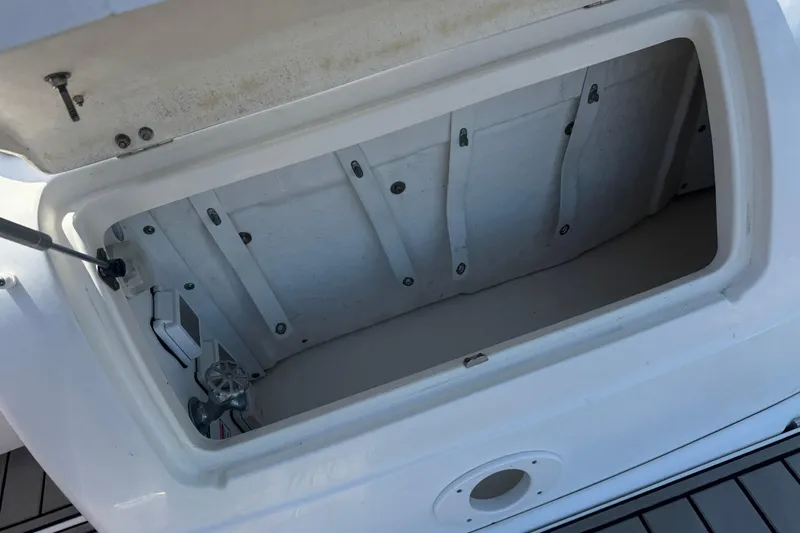 Slide: The Image of Open storage compartment on a 2006 Sea Ray Sundancer 260 boat. - 7