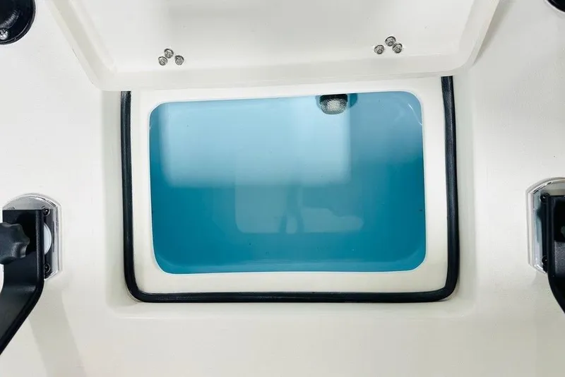 Slide: The Image of 2026 Hewes Redfisher 18 livewell with blue interior and secure lid. - 5