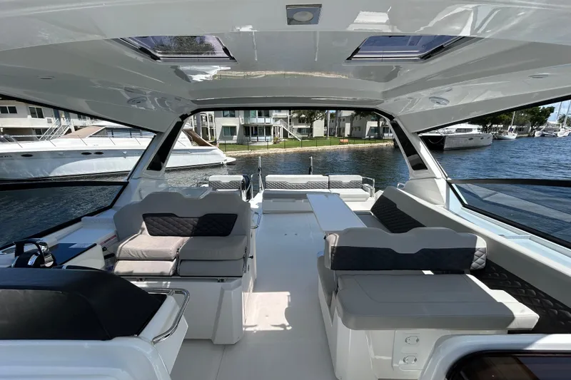 Slide: The Image of Interior view of 2020 Aquila 36 Sport yacht, featuring spacious seating and modern design. - 12