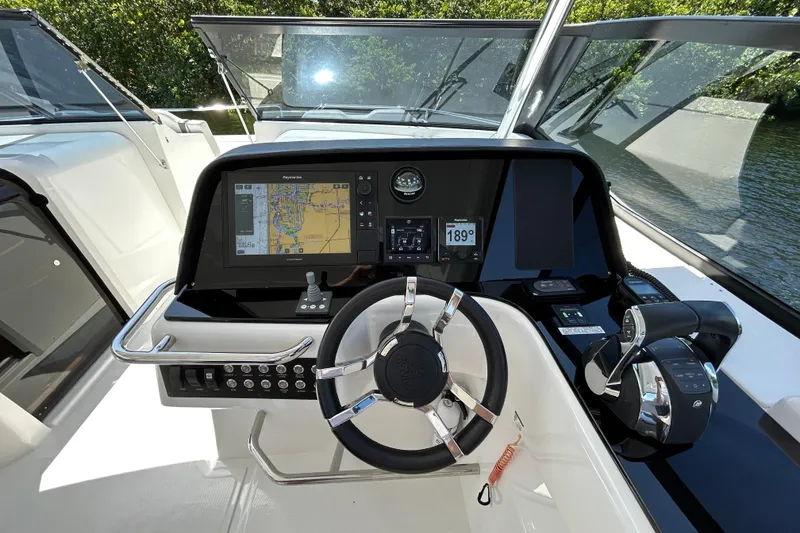 Slide: The Image of Helm of 2020 Aquila 36 Sport boat with navigation display and controls. - 13