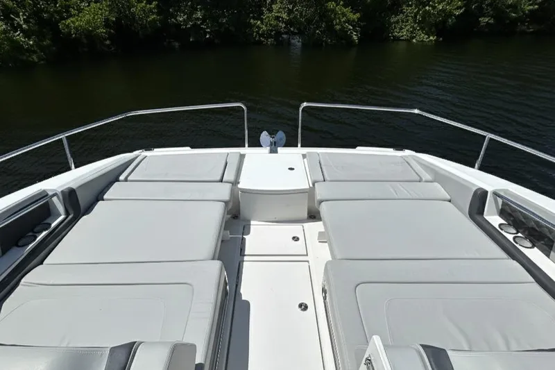 Slide: The Image of Aquila 36 Sport 2020 boat with spacious sunbathing deck on calm water. - 22