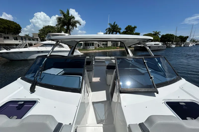Slide: The Image of 2020 Aquila 36 Sport boat docked, featuring sleek design and spacious deck. - 26