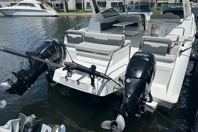 Slide: The Image of Aquila 36 Sport 2020 boat with dual outboard engines docked at marina. - 28