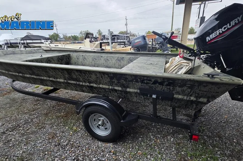 Slide: The Image of 2026 Tracker Grizzly 1754 Utility boat on trailer with Mercury outboard motor. - 4