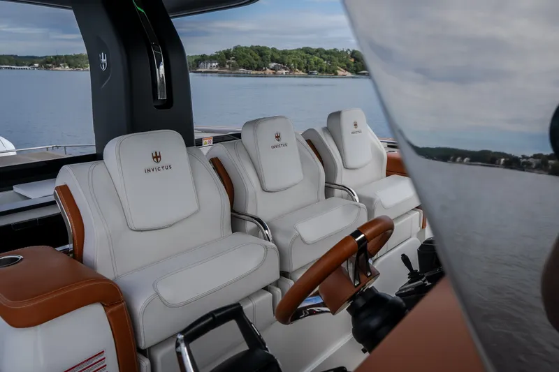 Slide: The Image of Luxury seating on 2025 Invictus TT430 yacht, featuring elegant white and brown leather design. - 60