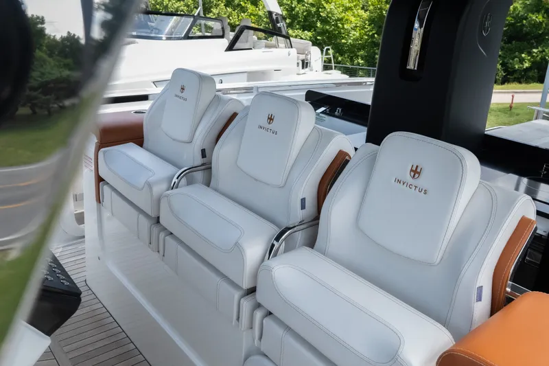 Slide: The Image of Luxurious seating on 2025 Invictus TT430 yacht, featuring elegant white upholstery and sleek design. - 33
