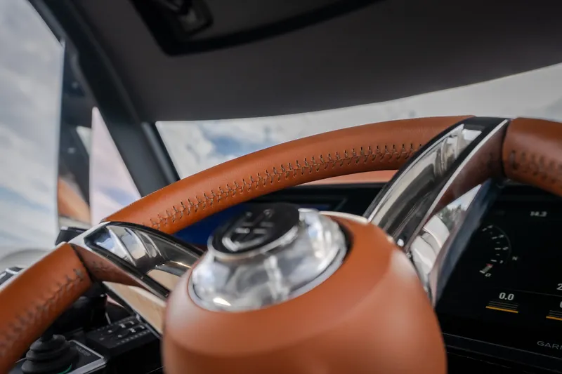 Slide: The Image of Luxurious steering wheel of 2025 Invictus TT430 with leather and chrome accents. - 55
