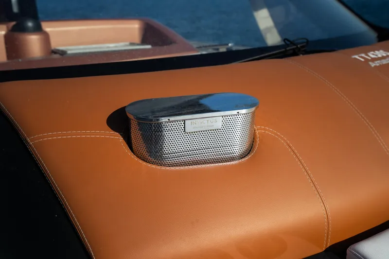 Slide: The Image of Close-up of Invictus TT430 2025 dashboard with sleek metallic detail. - 12