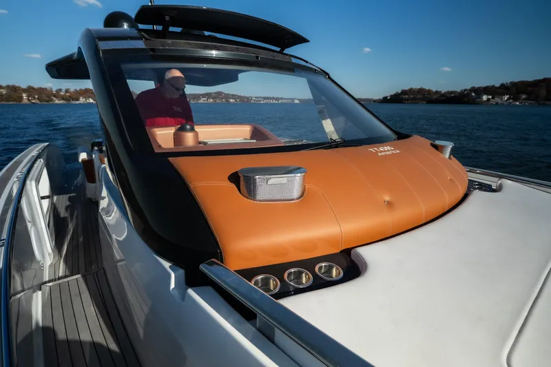 Slide: The Image of 2025 Invictus TT430 yacht cruising on a sunny day, featuring sleek design and luxury details. - 13