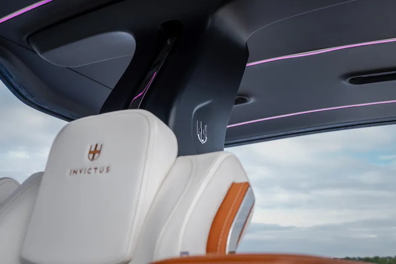 Slide: The Image of Interior of 2025 Invictus TT430 with luxurious seating and ambient lighting. - 50