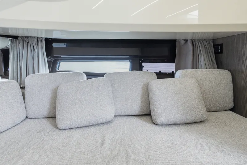 Slide: The Image of Interior of 2025 Invictus TT430 yacht with gray cushions and modern design. - 71