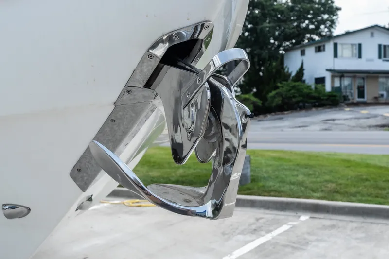 Slide: The Image of Chrome anchor detail on 2025 Invictus TT430 yacht, parked near a road. - 6