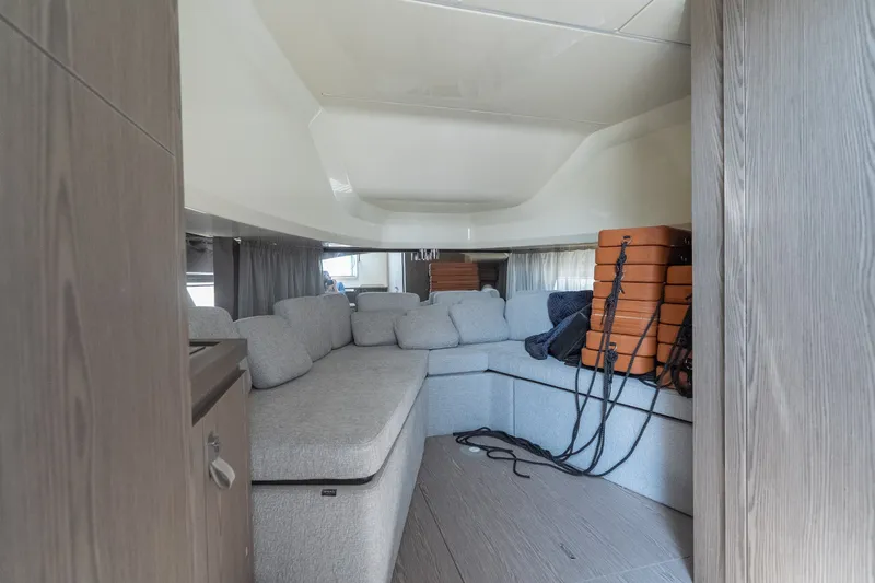 Slide: The Image of Interior of 2025 Invictus TT430 yacht with cozy seating and modern design. - 30