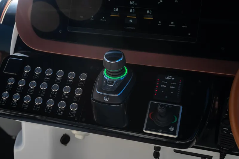 Slide: The Image of Control panel of 2025 Invictus TT430 boat with joystick and digital display. - 23