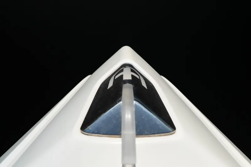 Slide: The Image of Close-up of 2025 Invictus TT430 boat's sleek bow design against a dark background. - 30