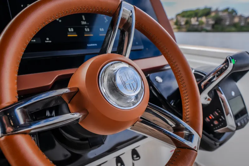 Slide: The Image of Steering wheel of 2025 Invictus TT430 yacht, featuring sleek design and advanced controls. - 53