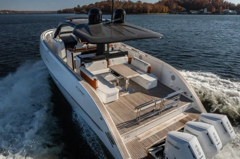 Slide: The Image of Luxury Invictus TT430 yacht cruising on a lake, showcasing sleek design and powerful engines. - 37