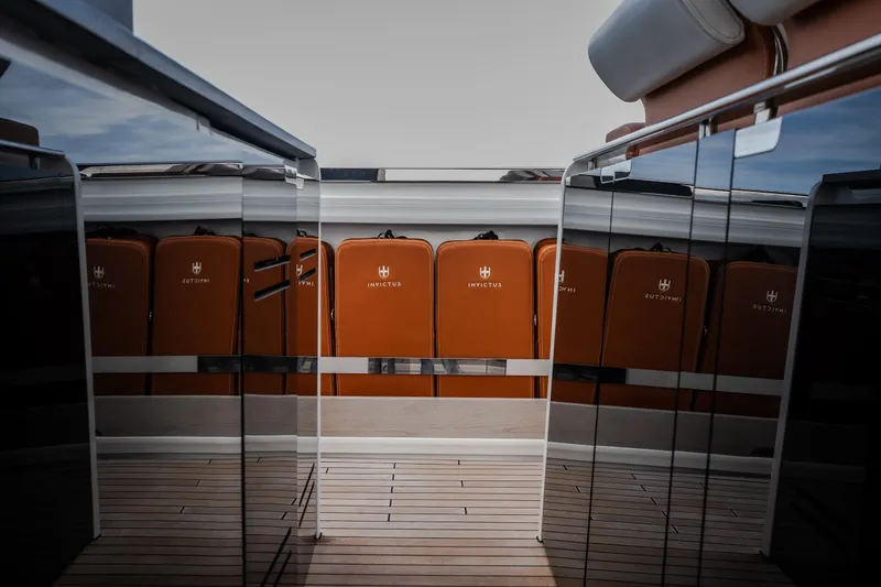 Slide: The Image of Luxurious Invictus TT430 yacht interior with sleek design and elegant seating, 2025 model. - 61