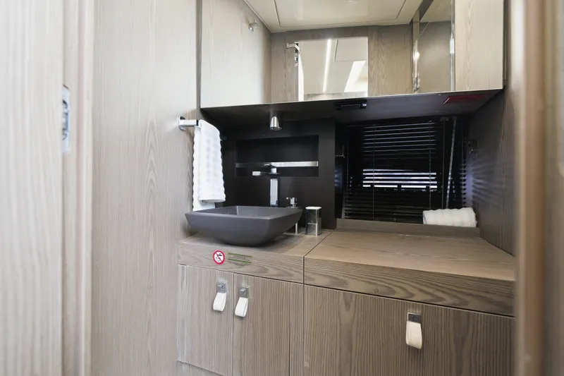 Slide: The Image of Modern bathroom interior in 2025 Invictus TT430 yacht, featuring sleek design and wood finishes. - 70