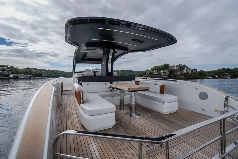Slide: The Image of Luxurious 2025 Invictus TT430 yacht with spacious deck and modern seating. - 25