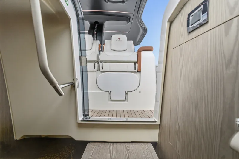 Slide: The Image of Interior view of 2025 Invictus TT430 yacht, showcasing sleek seating and modern design. - 74