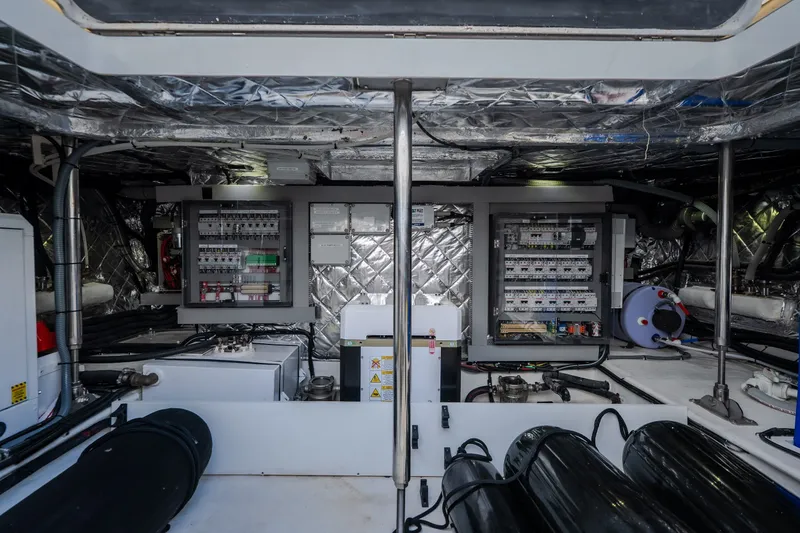 Slide: The Image of Engine room of 2025 Invictus TT430 yacht, showcasing advanced electrical systems and components. - 87