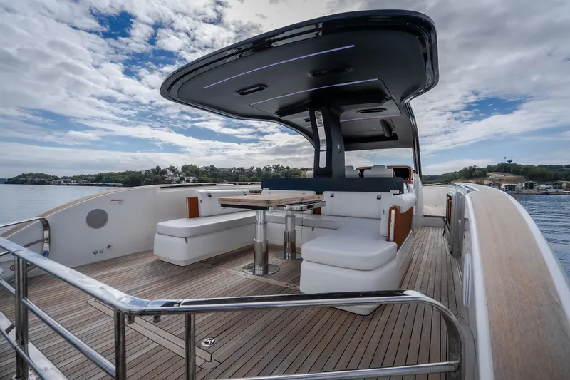 Slide: The Image of Luxurious 2025 Invictus TT430 yacht deck with modern seating and sleek design. - 23