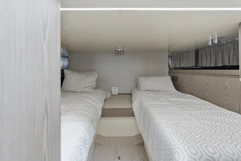 Slide: The Image of Interior of 2025 Invictus TT430 yacht with twin beds and modern design. - 73