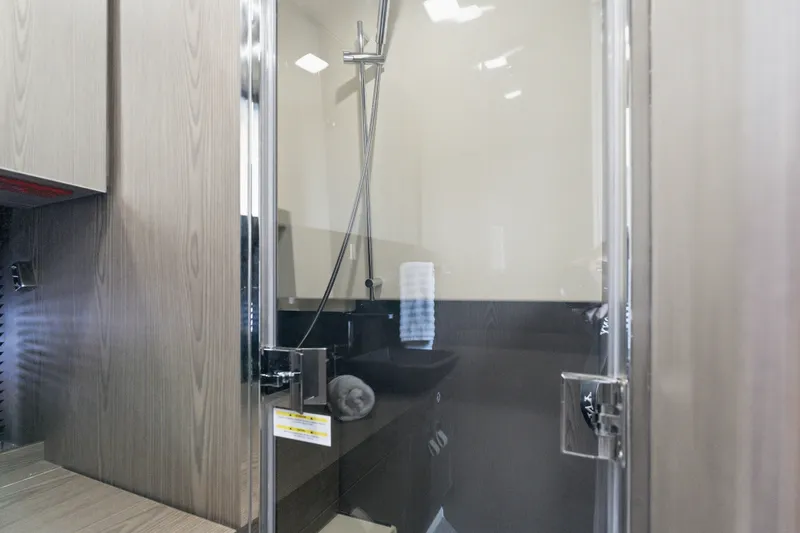 Slide: The Image of Modern bathroom interior in 2025 Invictus TT430, featuring sleek shower and wooden cabinetry. - 80