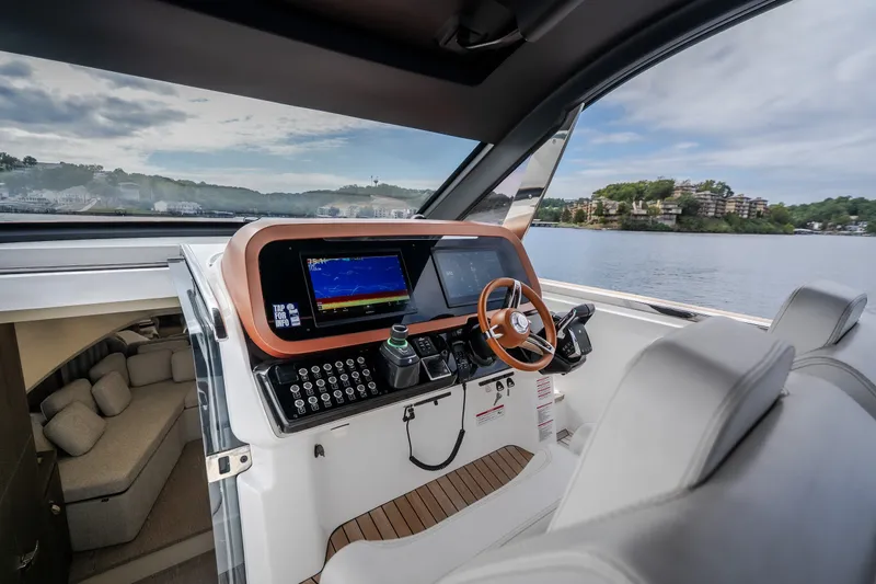 Slide: The Image of Modern helm of 2025 Invictus TT430 yacht with advanced navigation system and luxurious interior. - 44