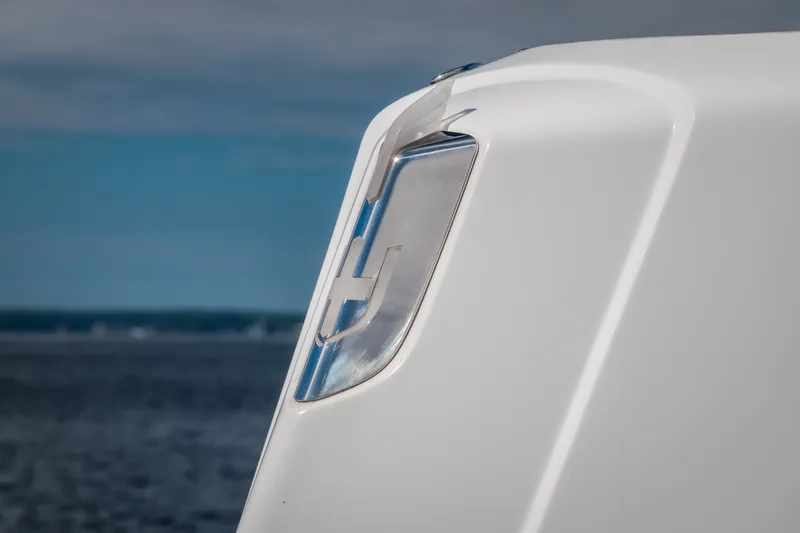 Slide: The Image of Close-up of 2025 Invictus TT430 yacht detail against ocean backdrop. - 100