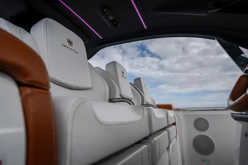 Slide: The Image of Luxurious interior of 2025 Invictus TT430 yacht with white leather seating and panoramic view. - 58