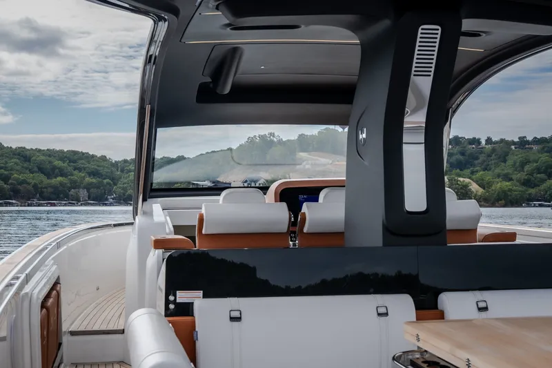 Slide: The Image of Luxurious 2025 Invictus TT430 yacht interior with scenic water and forest view. - 26