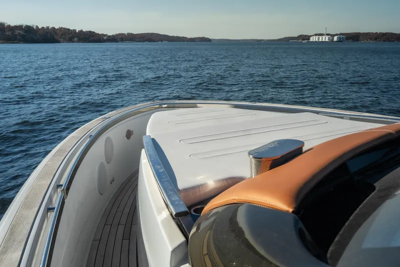 Slide: The Image of 2025 Invictus TT430 yacht deck overlooking serene blue waters. - 8