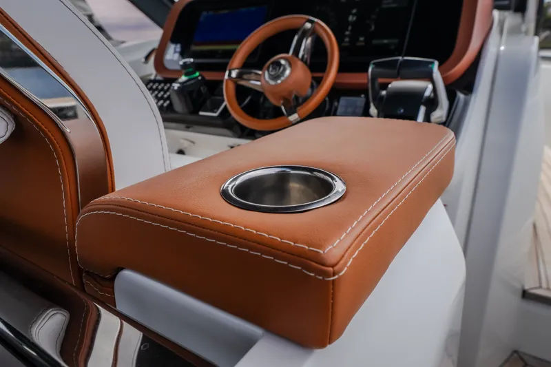 Slide: The Image of Luxurious interior of 2025 Invictus TT430 yacht with leather armrest and cup holder. - 42