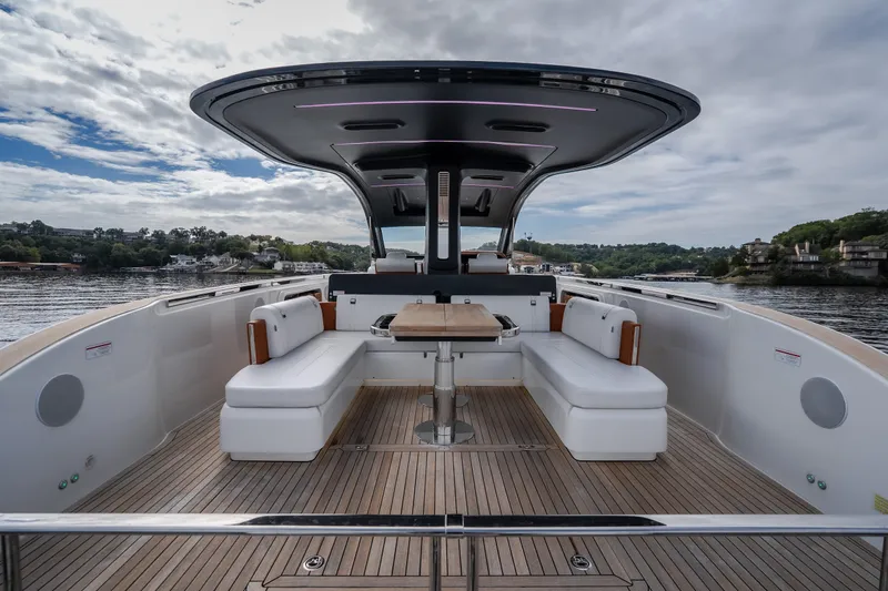 Slide: The Image of Luxurious 2025 Invictus TT430 yacht interior with elegant seating and scenic water view. - 24